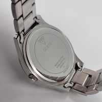 GUESS Ladies Silver Tone Triangle Dial Analog Watch GW0605L1 Stylish Chic