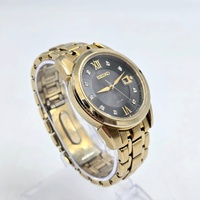 Seiko V157-0BF0 Date Display Gold Tone Stainless Steel 10Bar Solar Mens Watch