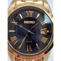 Seiko V157-0BF0 Date Display Gold Tone Stainless Steel 10Bar Solar Mens Watch