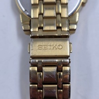 Seiko V157-0BF0 Date Display Gold Tone Stainless Steel 10Bar Solar Mens Watch