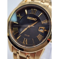 Seiko V157-0BF0 Date Display Gold Tone Stainless Steel 10Bar Solar Mens Watch