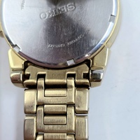 Seiko V157-0BF0 Date Display Gold Tone Stainless Steel 10Bar Solar Mens Watch