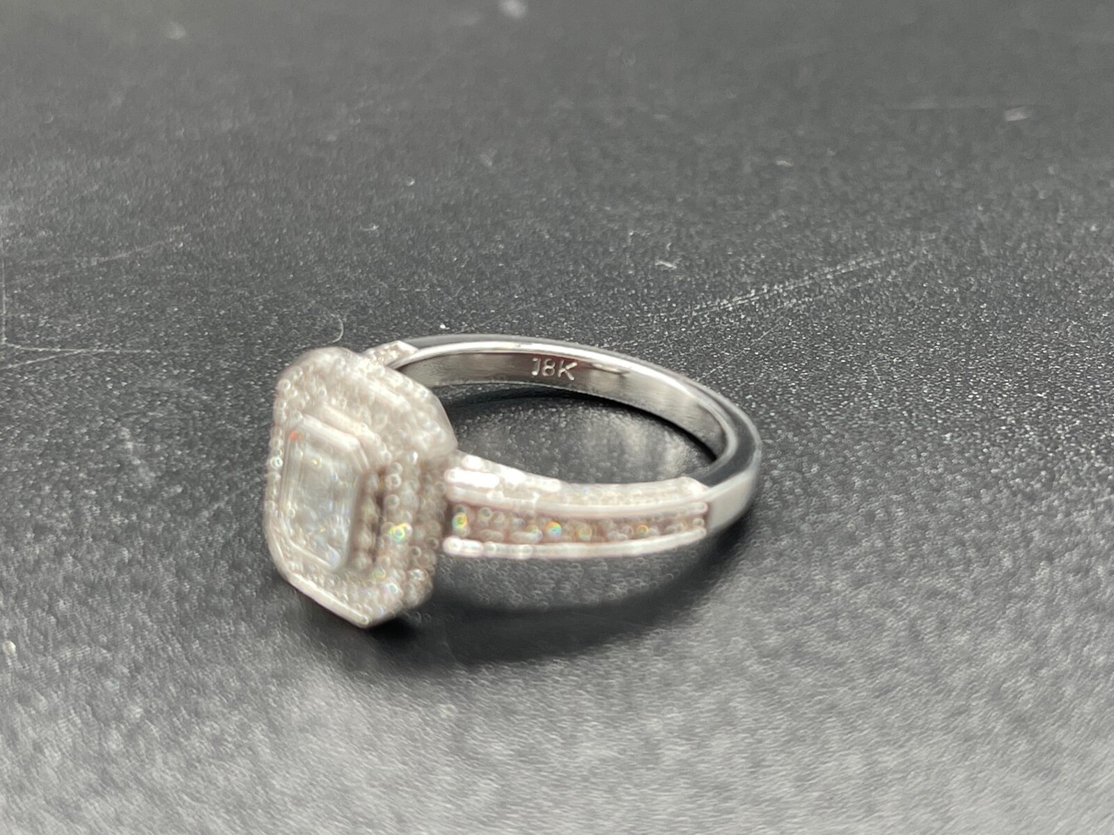 Pre owned emerald cut engagement rings on sale