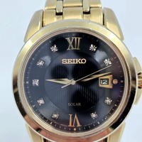 Seiko V157-0BF0 Date Display Gold Tone Stainless Steel 10Bar Solar Mens Watch