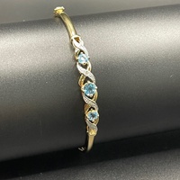 Ladies 9ct Yellow Gold Blue Stone Trifari Bangle