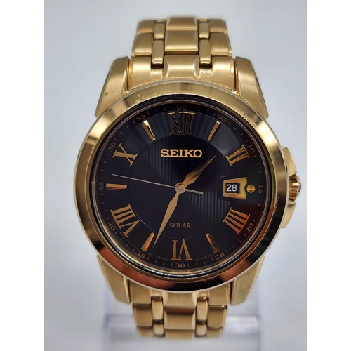 Seiko V157-0BF0 Date Display Gold Tone Stainless Steel 10Bar Solar Mens Watch